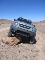 Nissan Xterra - Holding a rock down